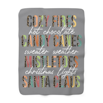 Grey Christmas sherpa fleece blanket with cozy holiday word art design