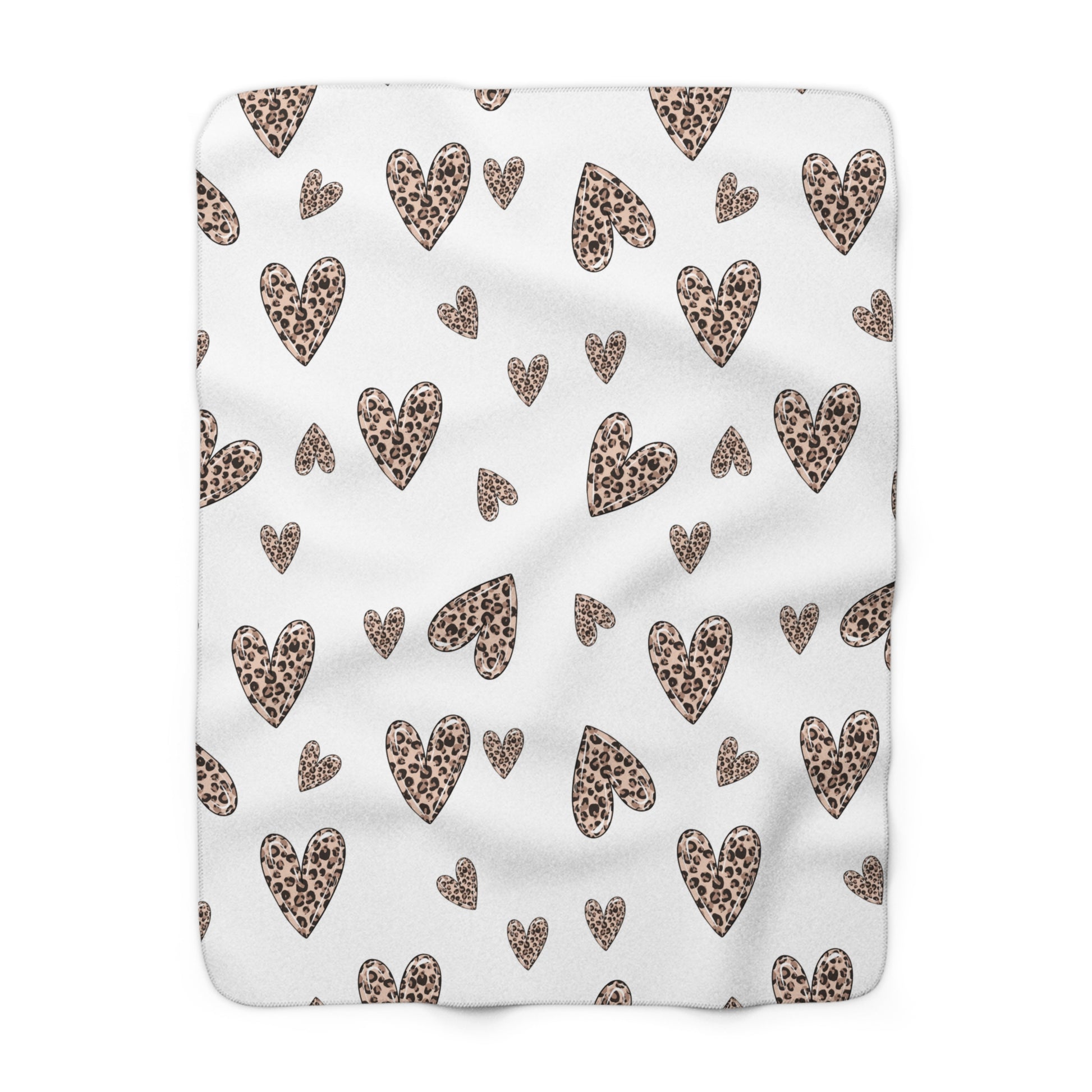 White Valentine’s sherpa fleece blanket with leopard heart pattern