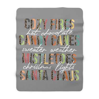 Grey Christmas sherpa fleece blanket with cozy holiday word art design