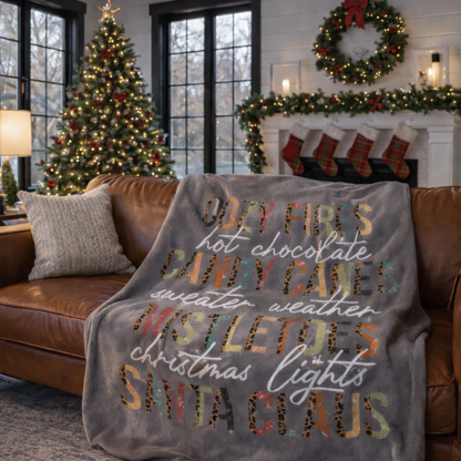 Grey Christmas sherpa fleece blanket with cozy holiday word art design